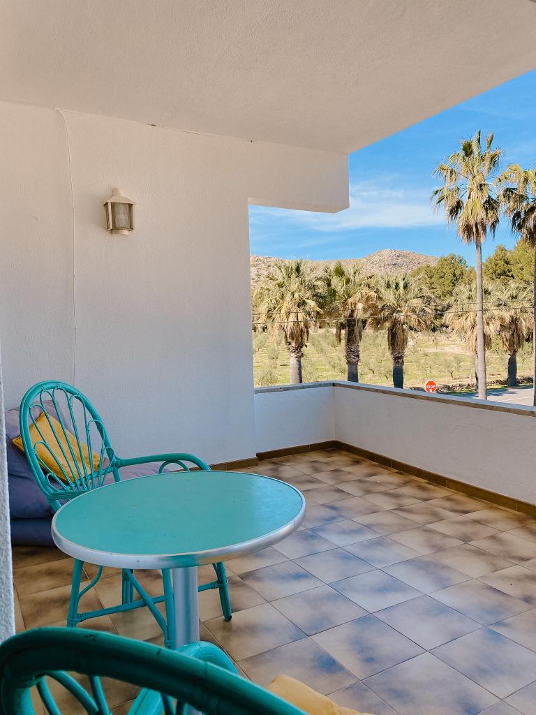 Terrace with mountain and palm tree views at Island Vibes Studios